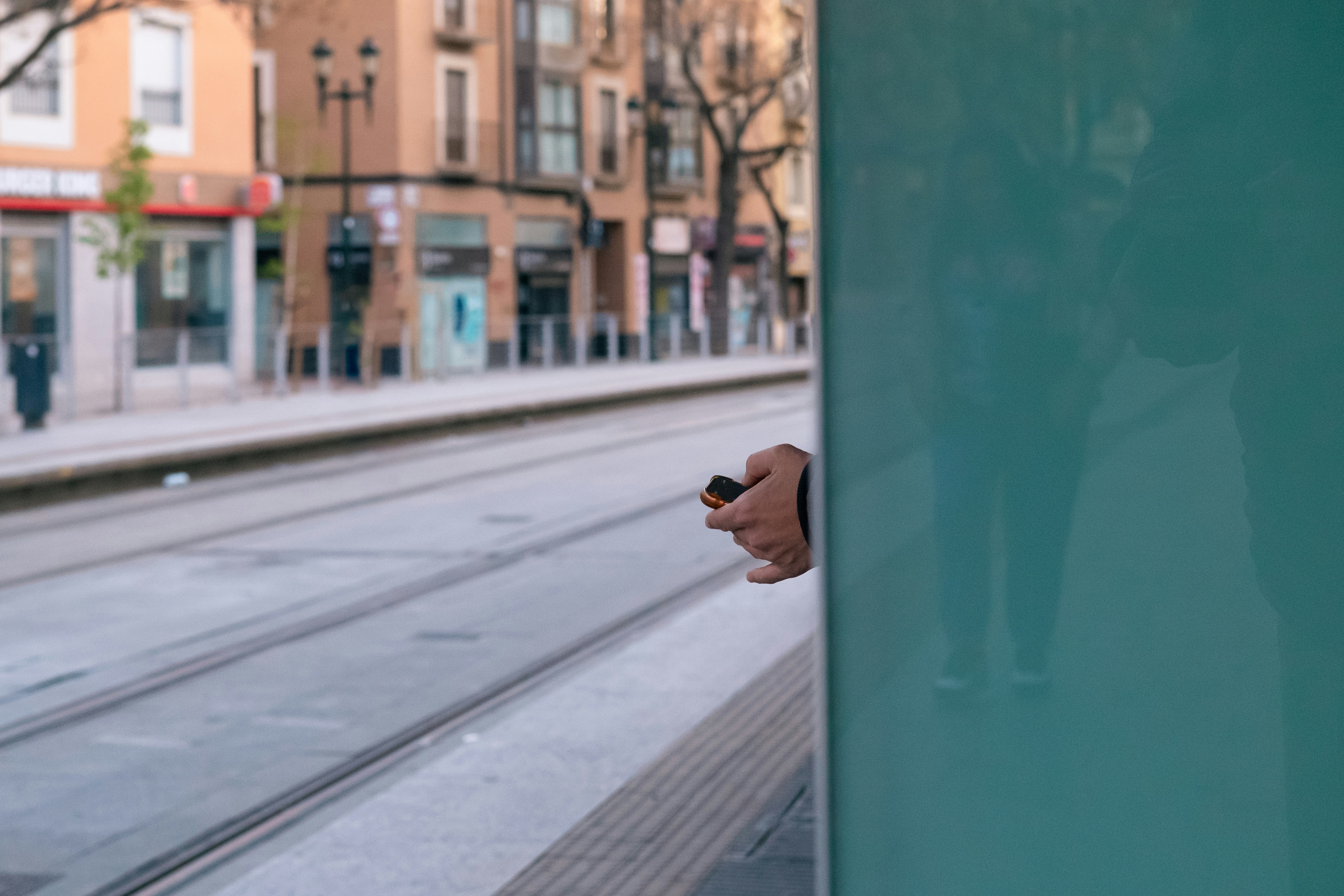 a person holding a cell phone in their hand