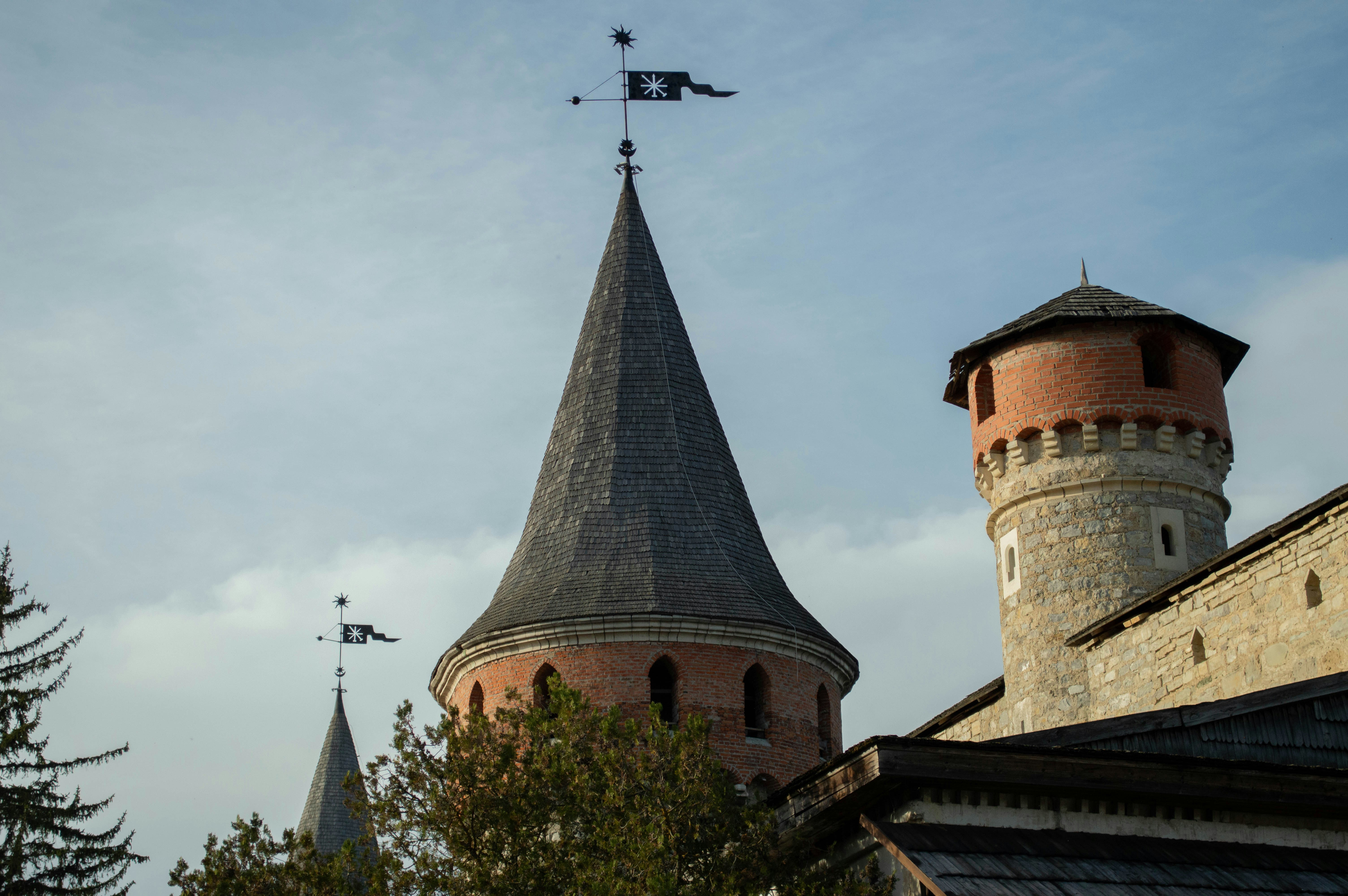 a tower with a weather vane on top of it