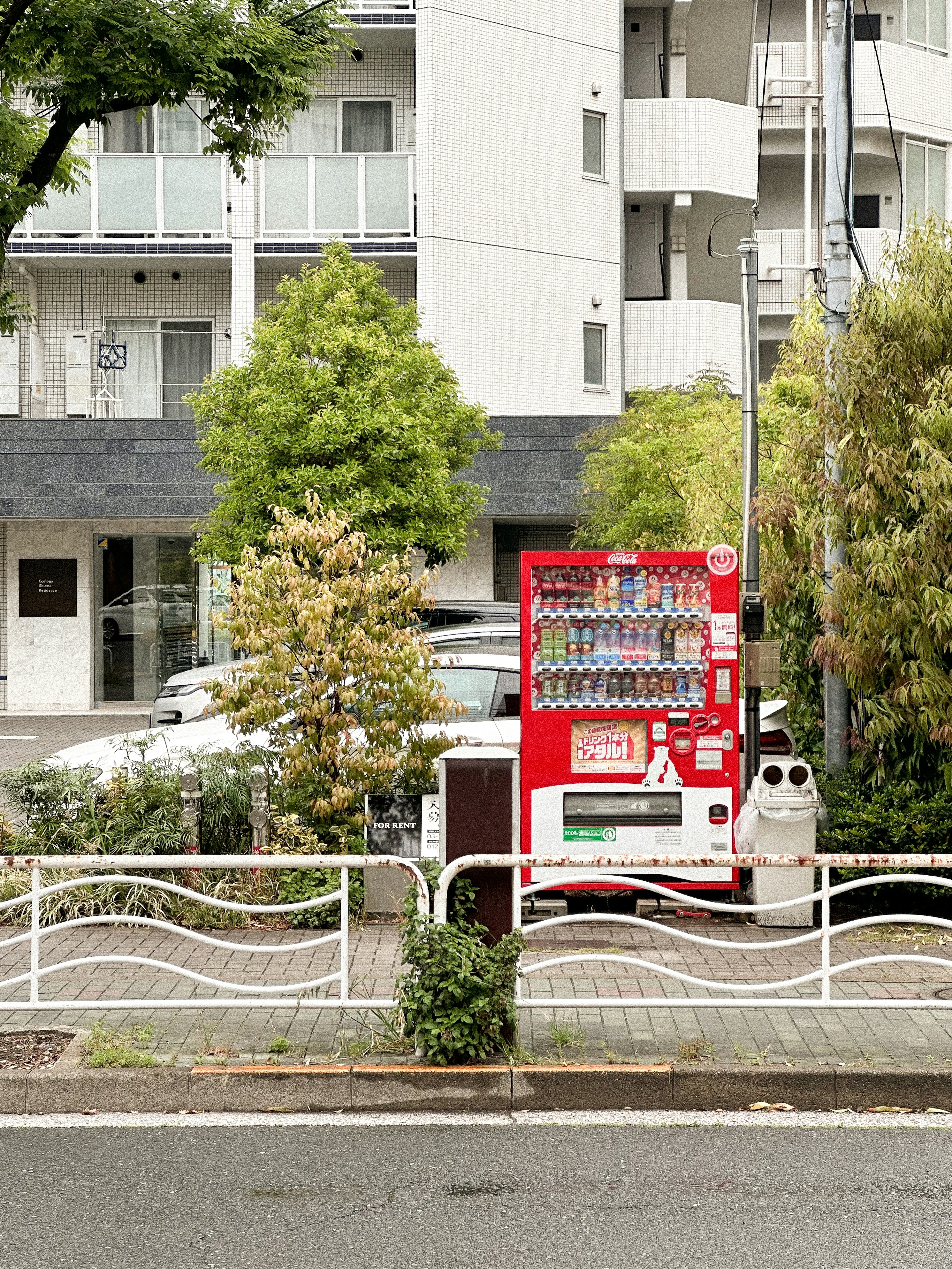 a vending machine sitting on the side of a road