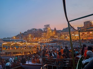 a large group of people on a boat in the water