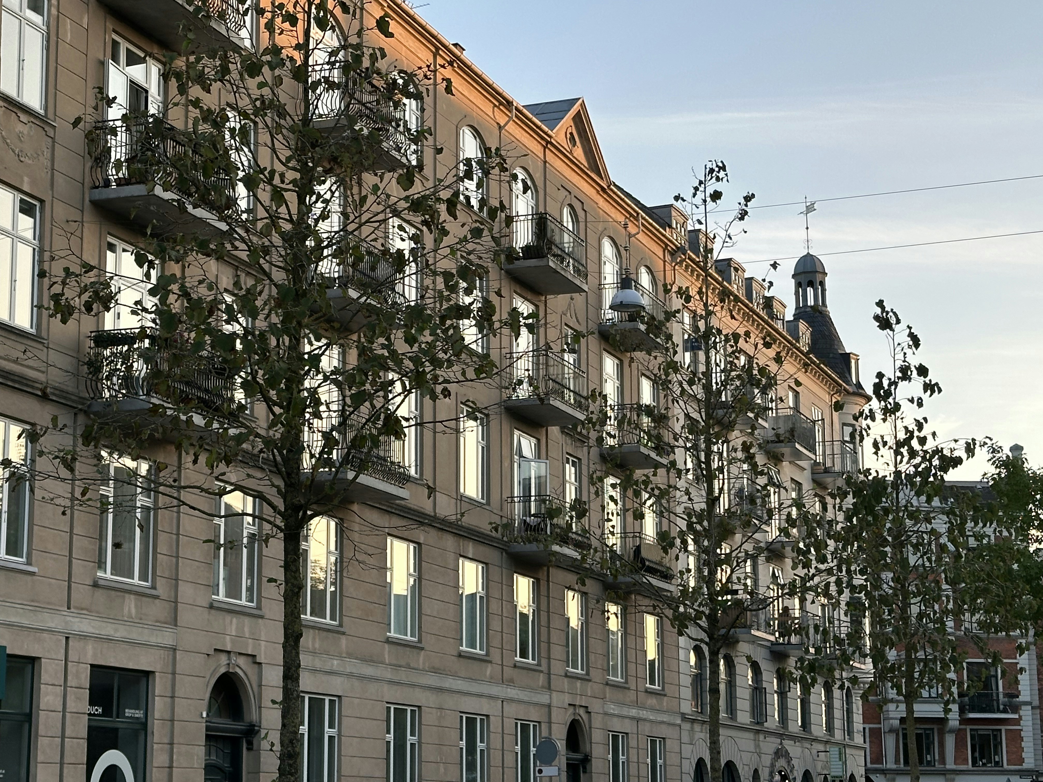 a large building with many windows and a clock tower