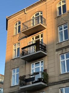 an apartment building with balconies and balconies on the balconies