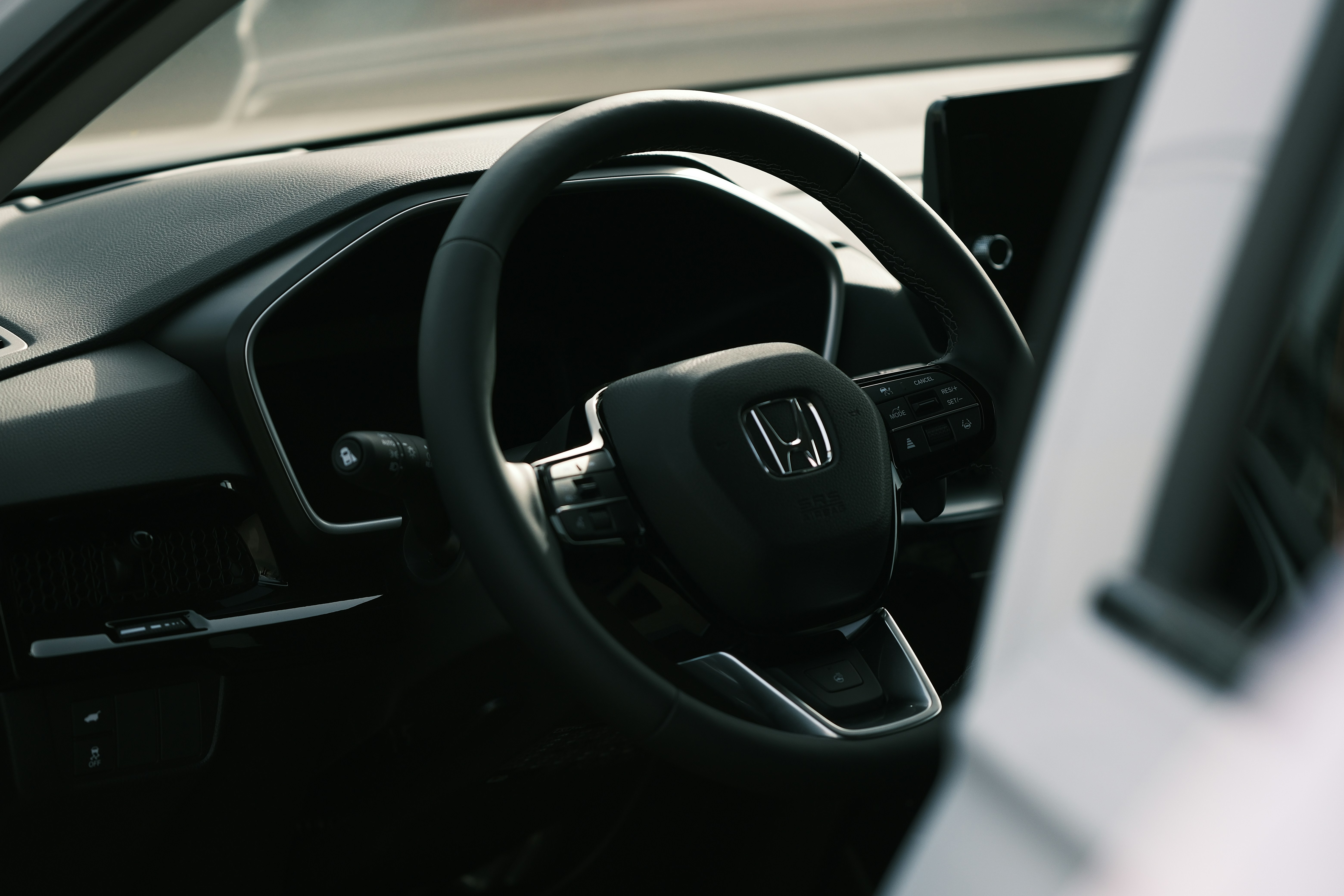 a steering wheel and dashboard of a car