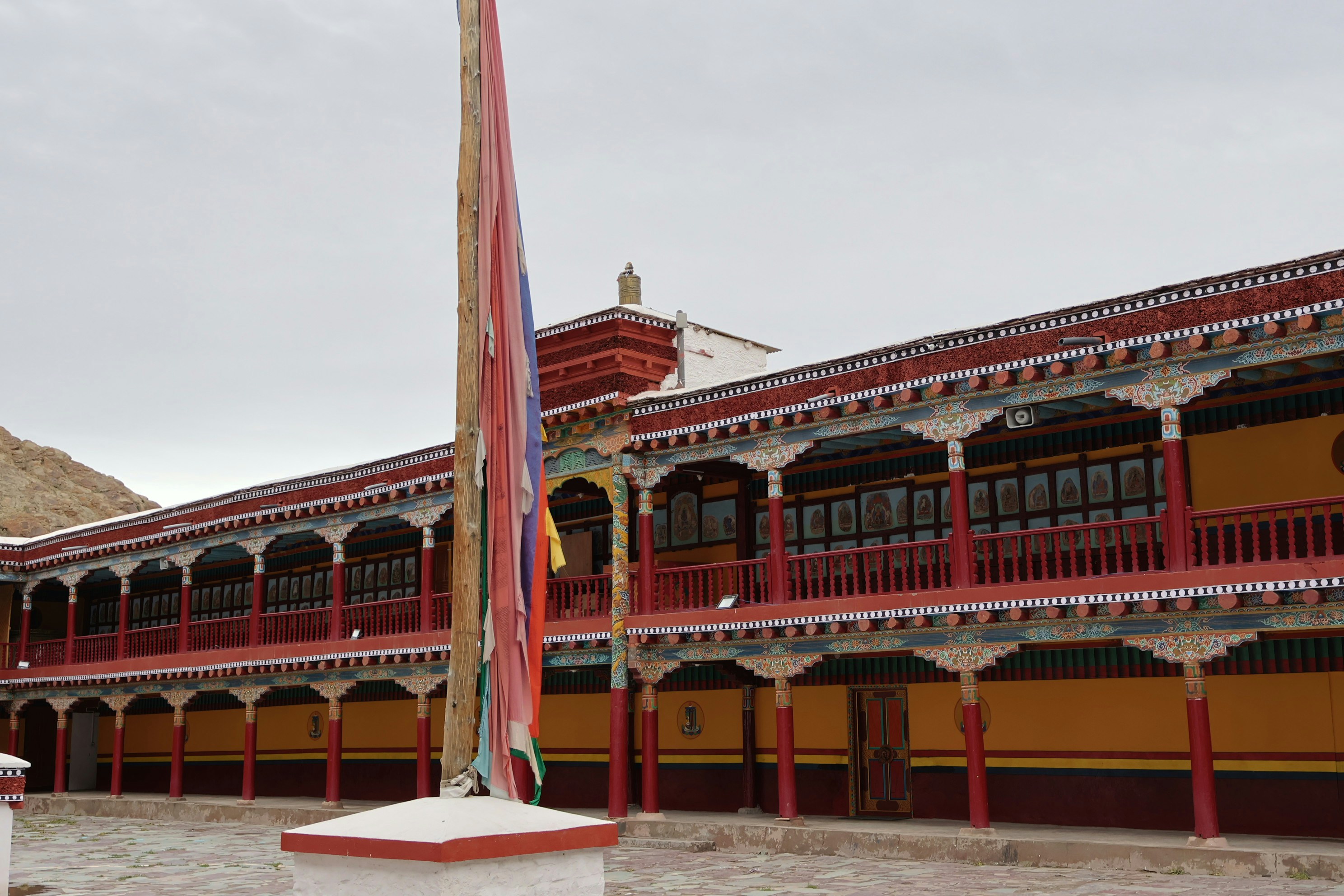 a large building with a flag pole in front of it