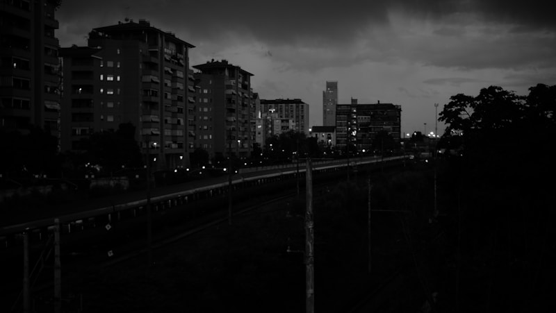 a black and white photo of a city at night