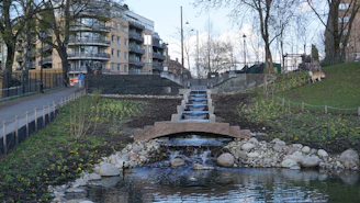 a small pond with a waterfall in the middle of it