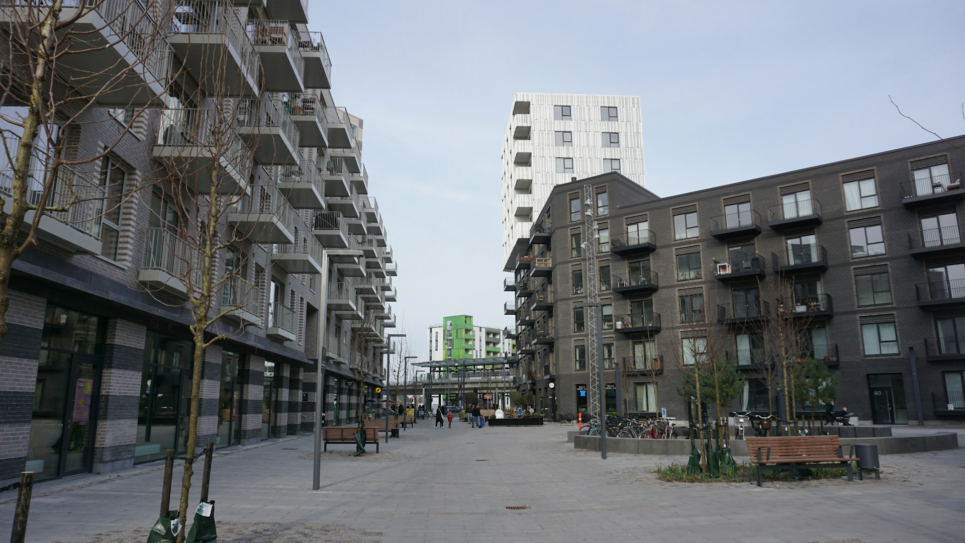 a city street lined with tall buildings next to each other