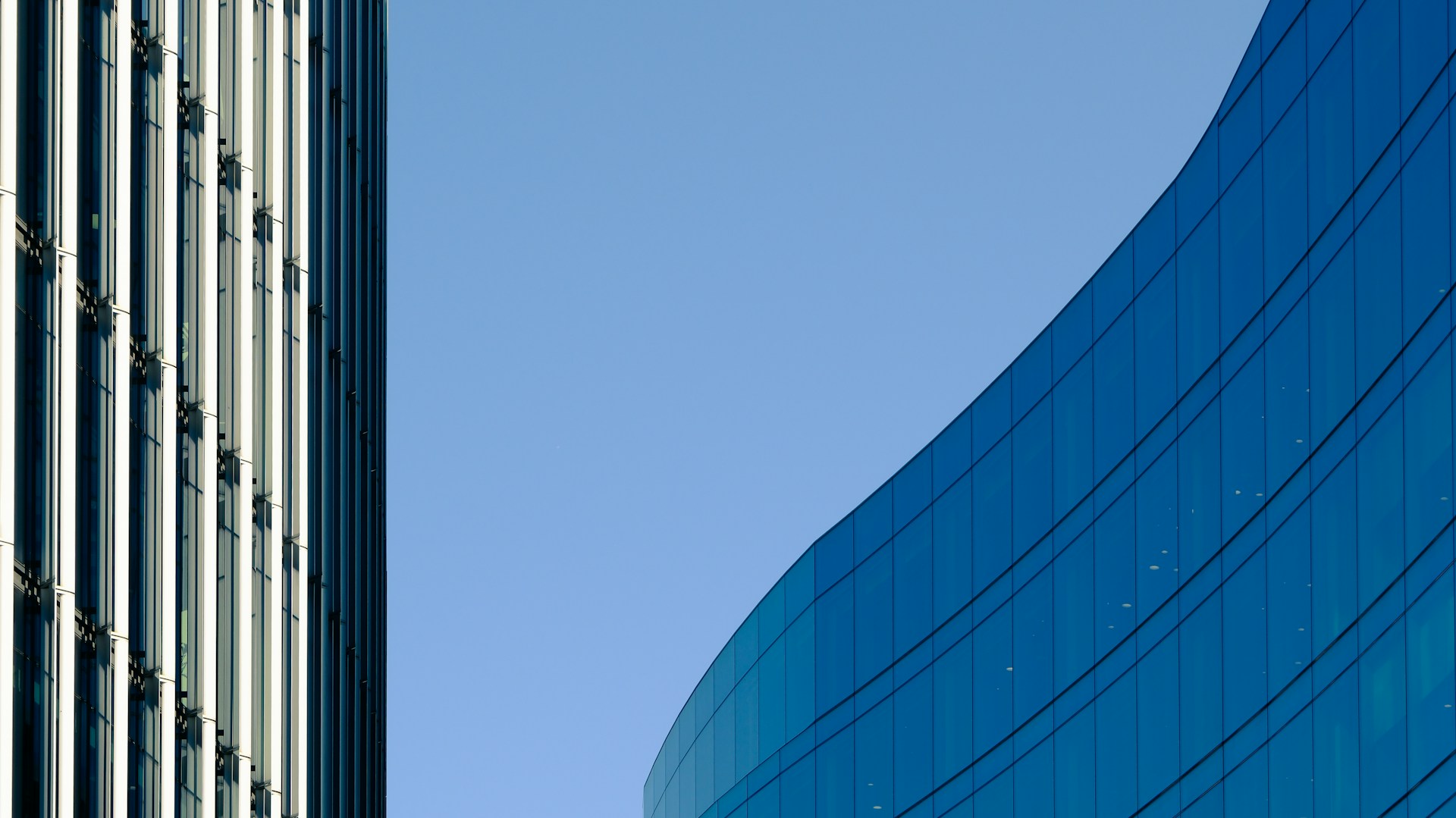 a tall building next to a very tall building