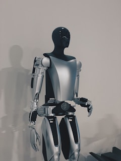 a robot standing in front of a white wall
