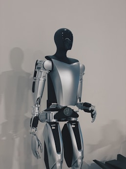a robot standing in front of a white wall