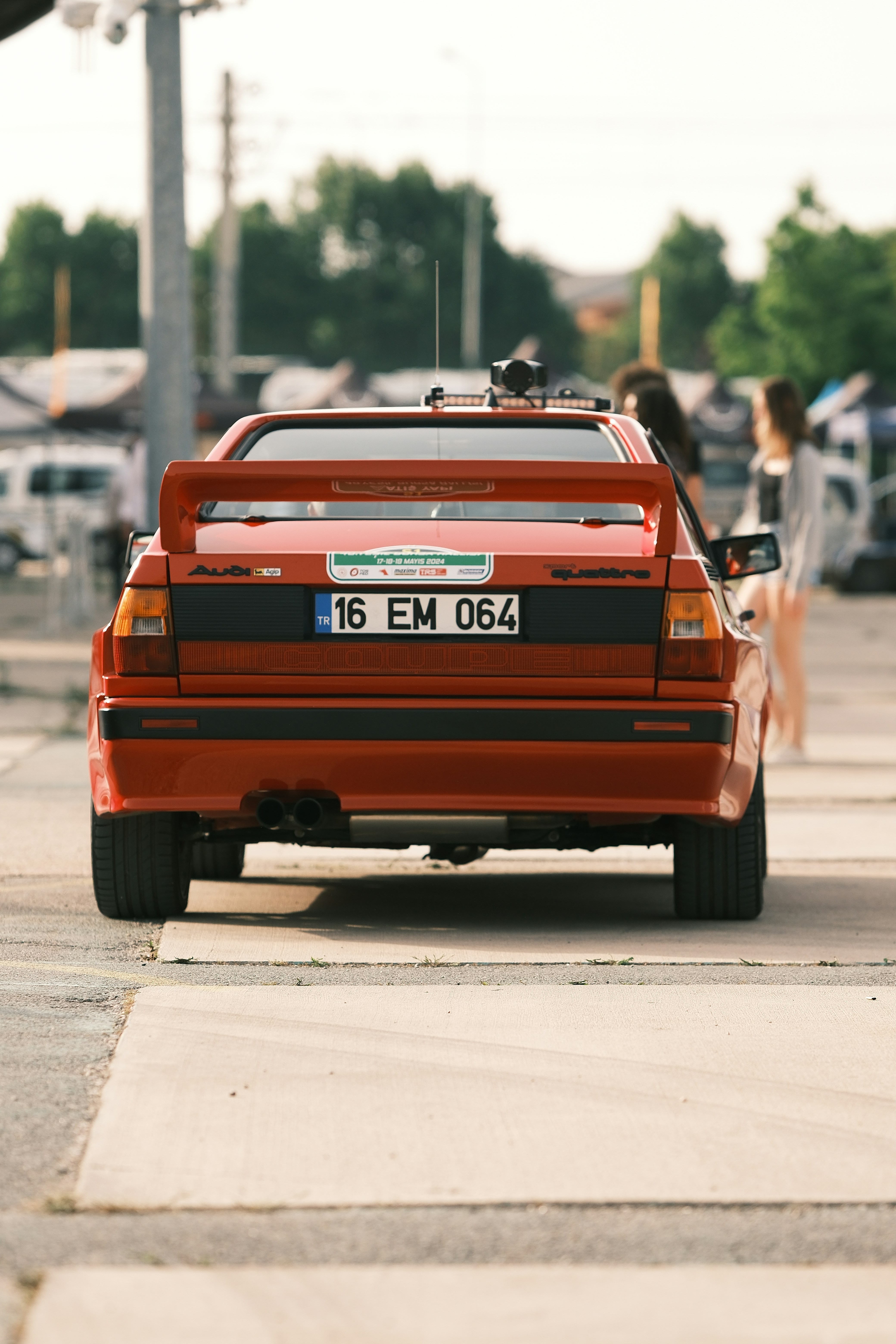 a red car parked on the side of the road