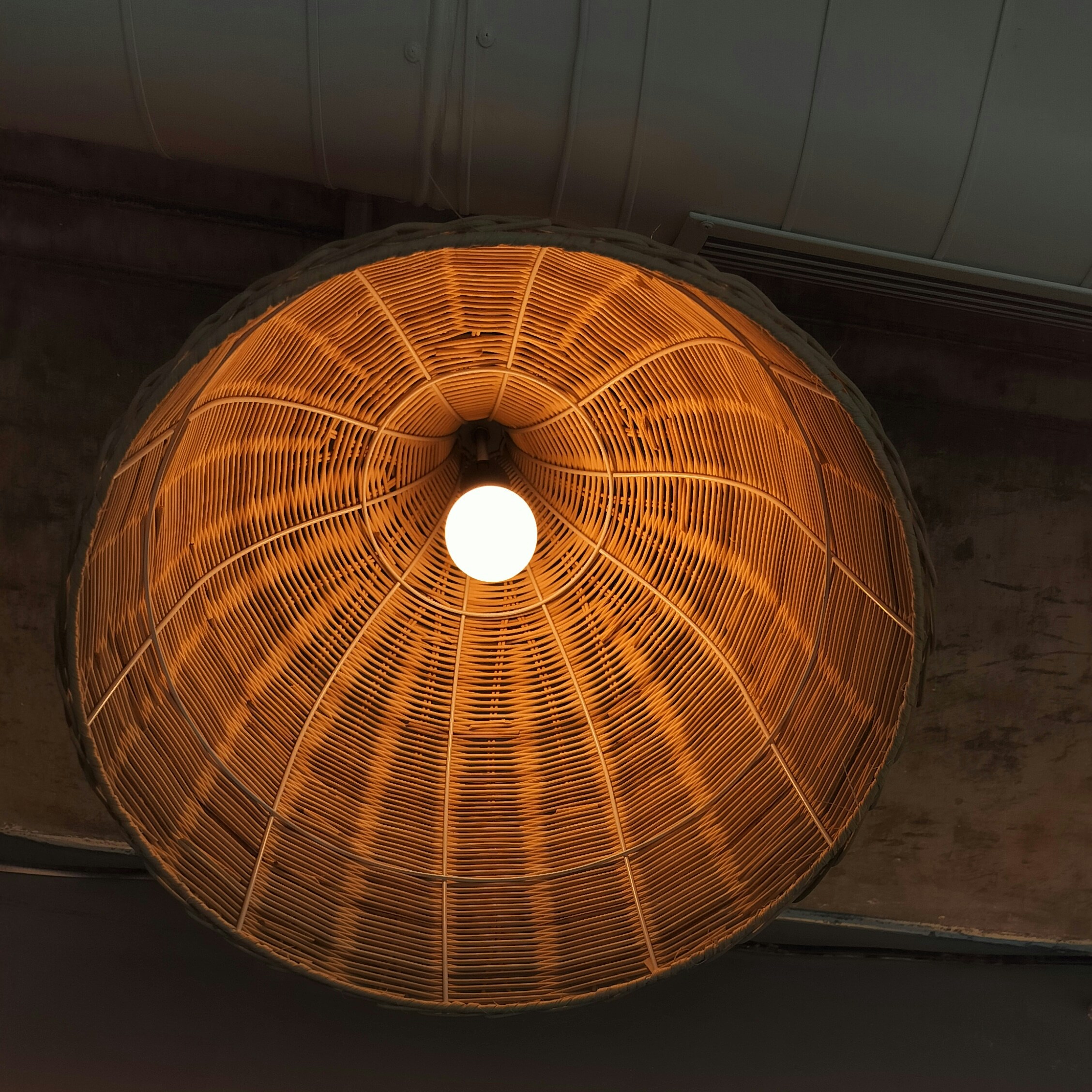 a lamp hanging from a ceiling in a room