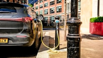 an electric car plugged in to a charging station
