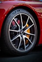 michelin tyre on red car near a tire shop in nigeria