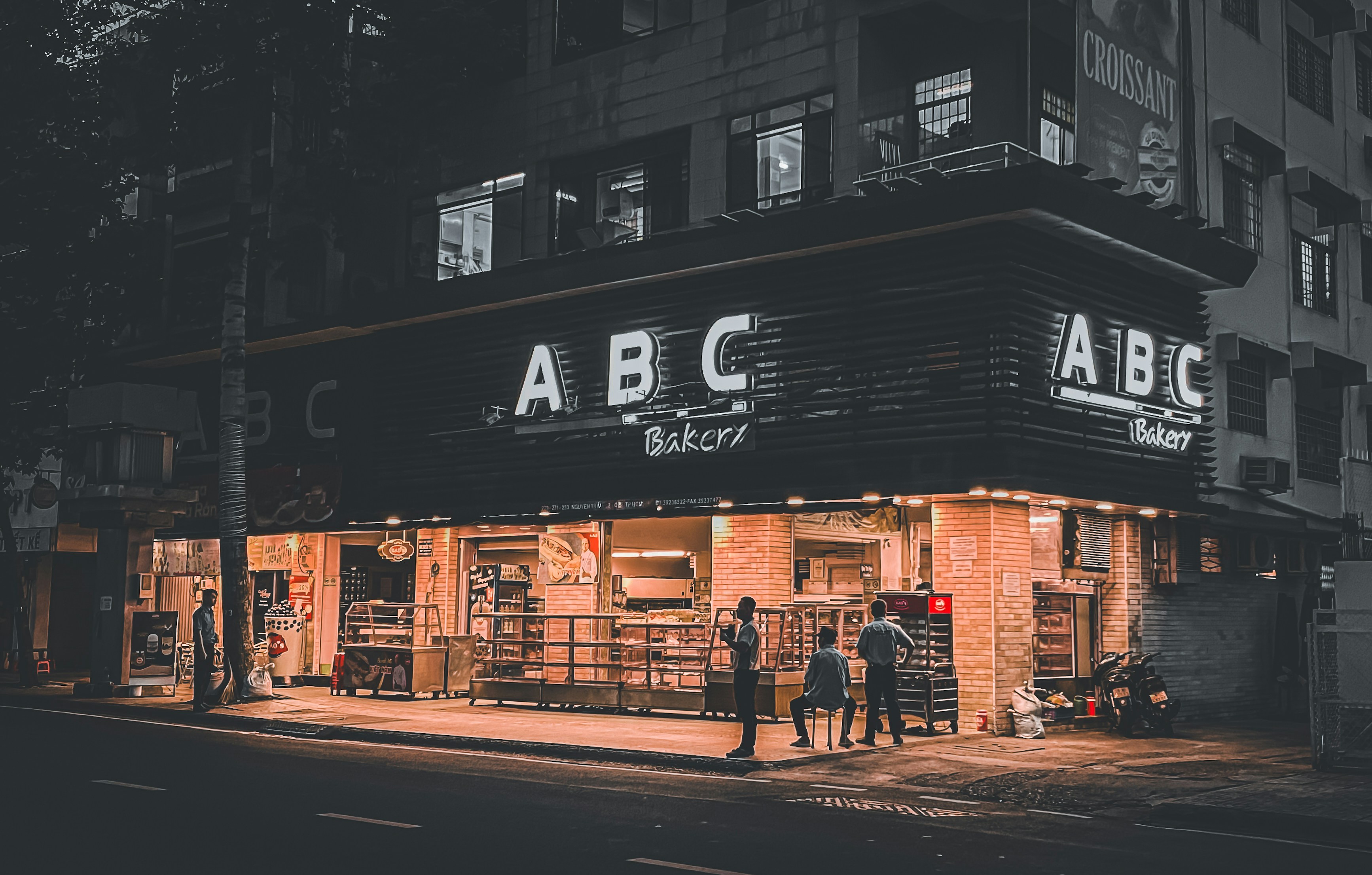 a group of people standing outside of a building