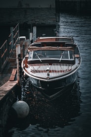 a boat docked at a dock in the water