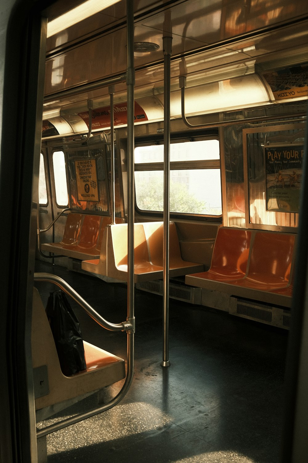 a view of a subway car from inside the car