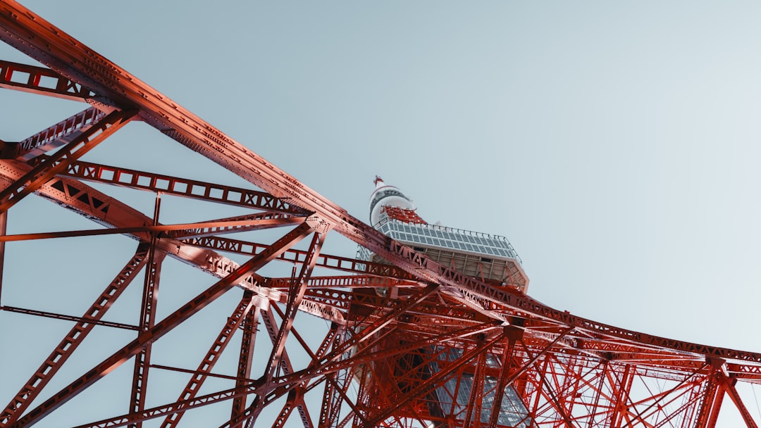 a tall red structure with a boat on top of it, 📍Tokyo