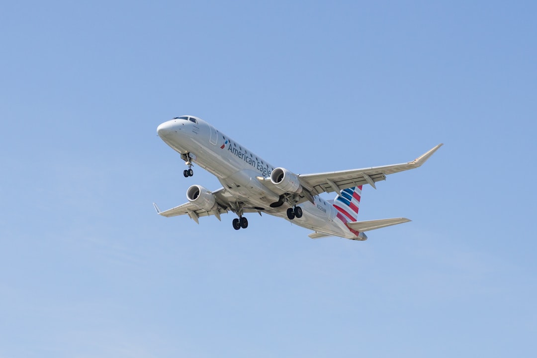 an airplane is flying in the sky with it