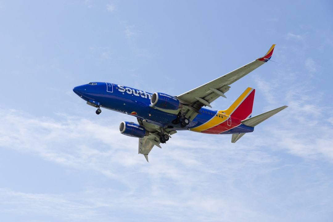 a southwest airlines plane flying in the sky,