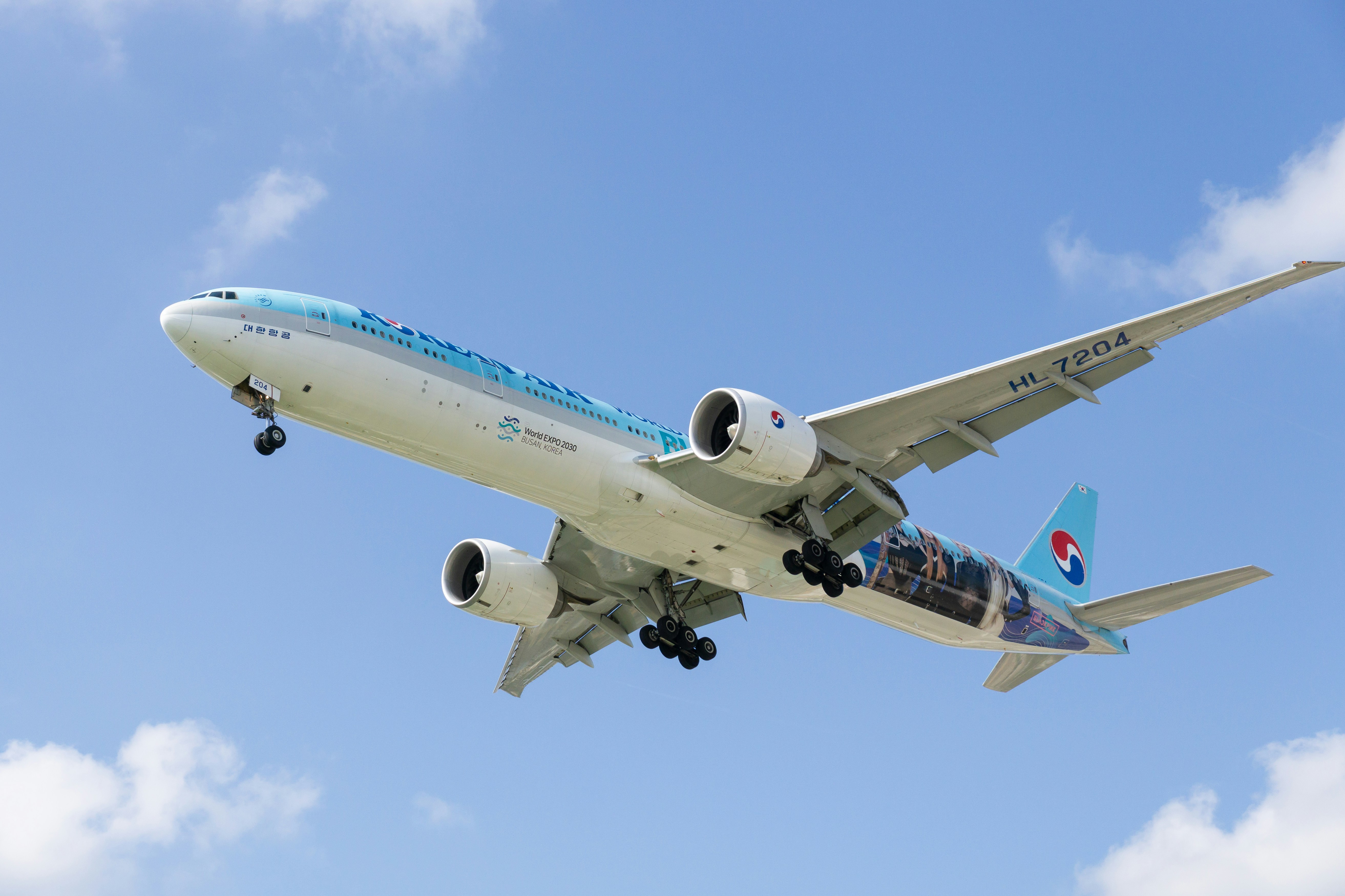 a large jetliner flying through a blue sky
