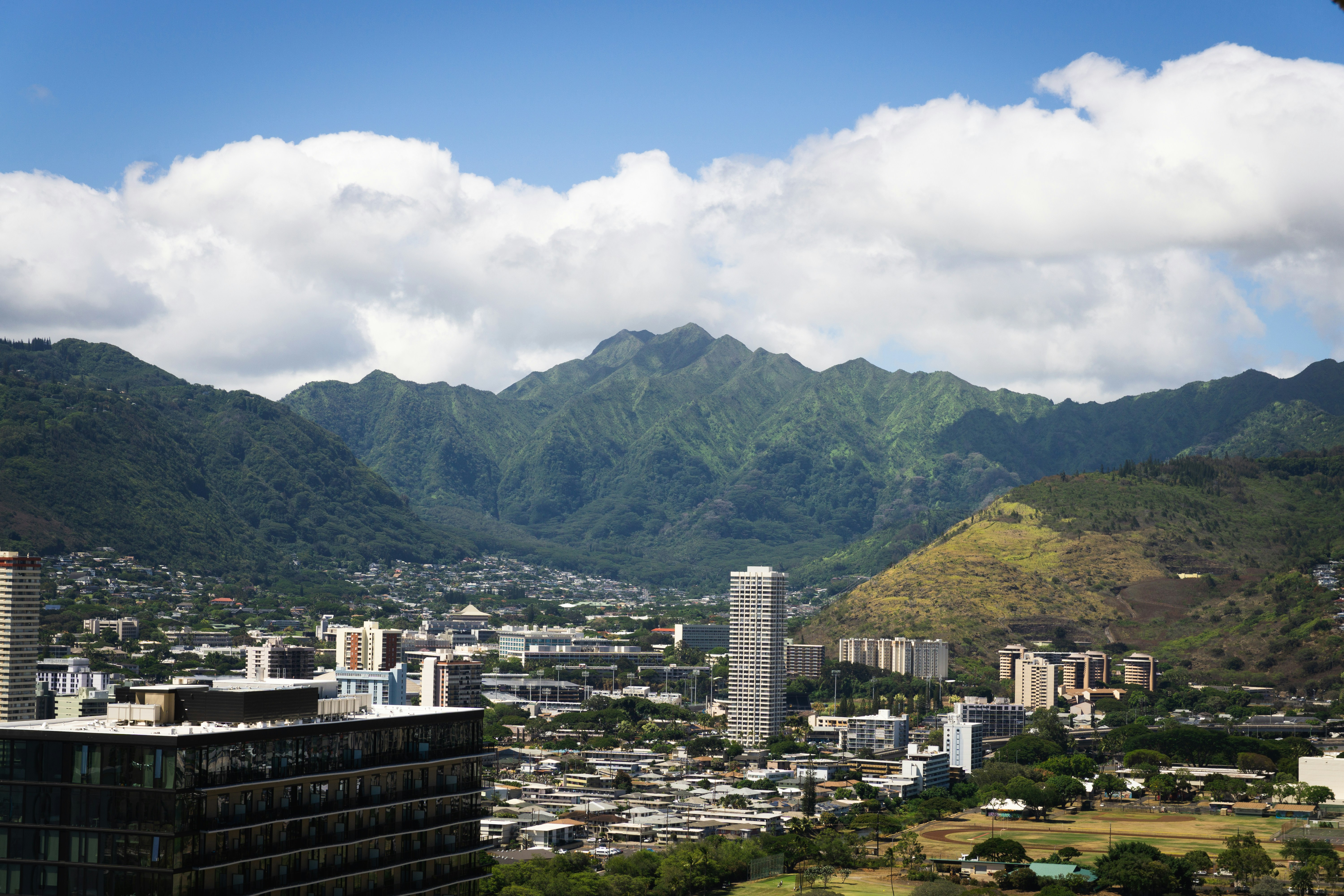 a view of a city with mountains in the background