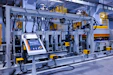 A control panel with a touchscreen on an industrial manufacturing machine in a factory