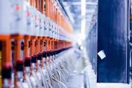 a row of orange and white electrical wires
