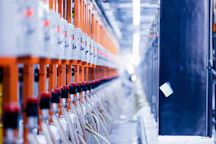 a row of orange and white electrical wires