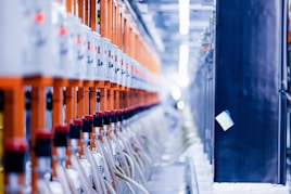 a row of orange and white electrical wires
