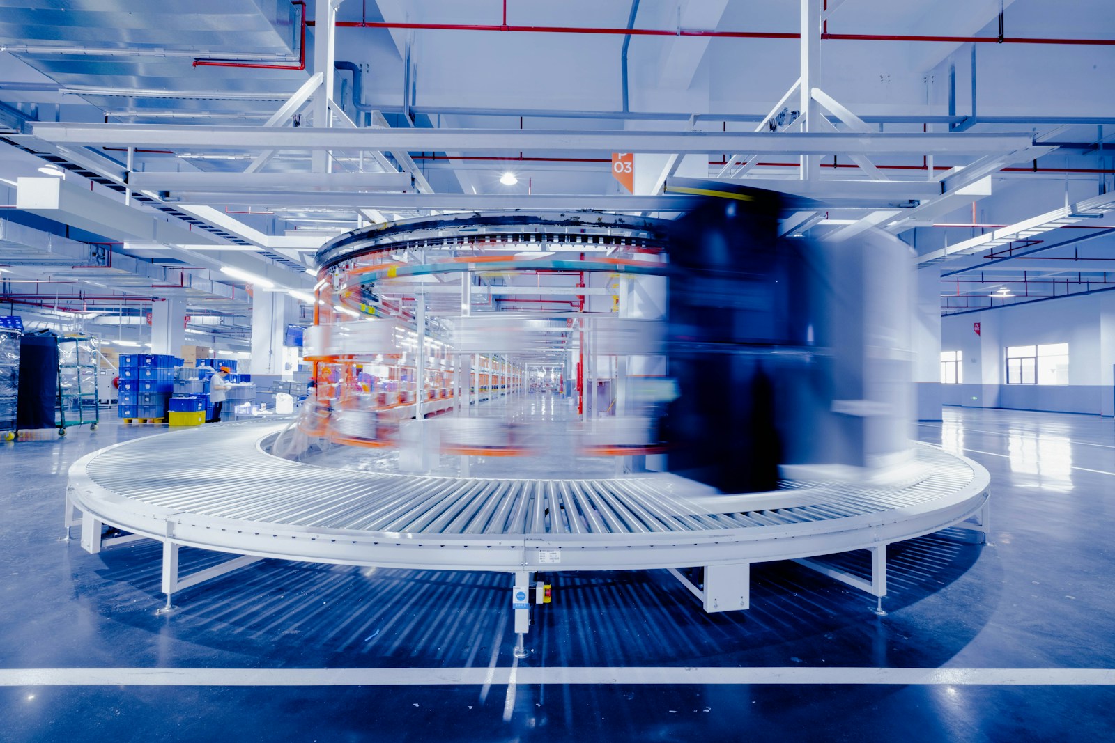 A large circular object inside a brightly lit industrial building