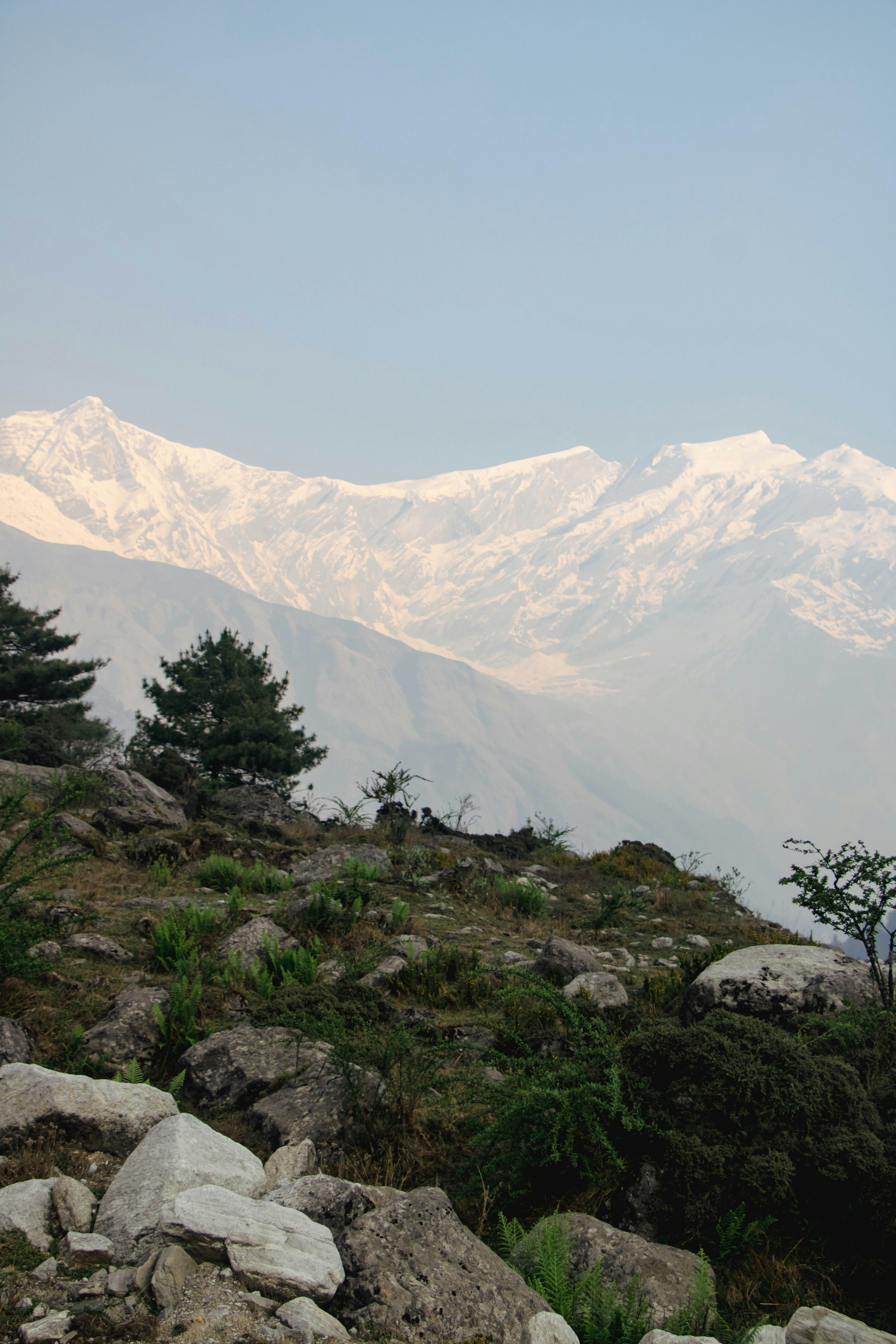 a mountain range with snow covered mountains in the background