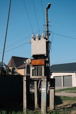 a telephone pole with a bunch of wires on top of it
