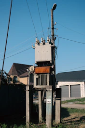 a telephone pole with a bunch of wires on top of it