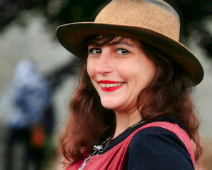 a woman wearing a hat and a scarf