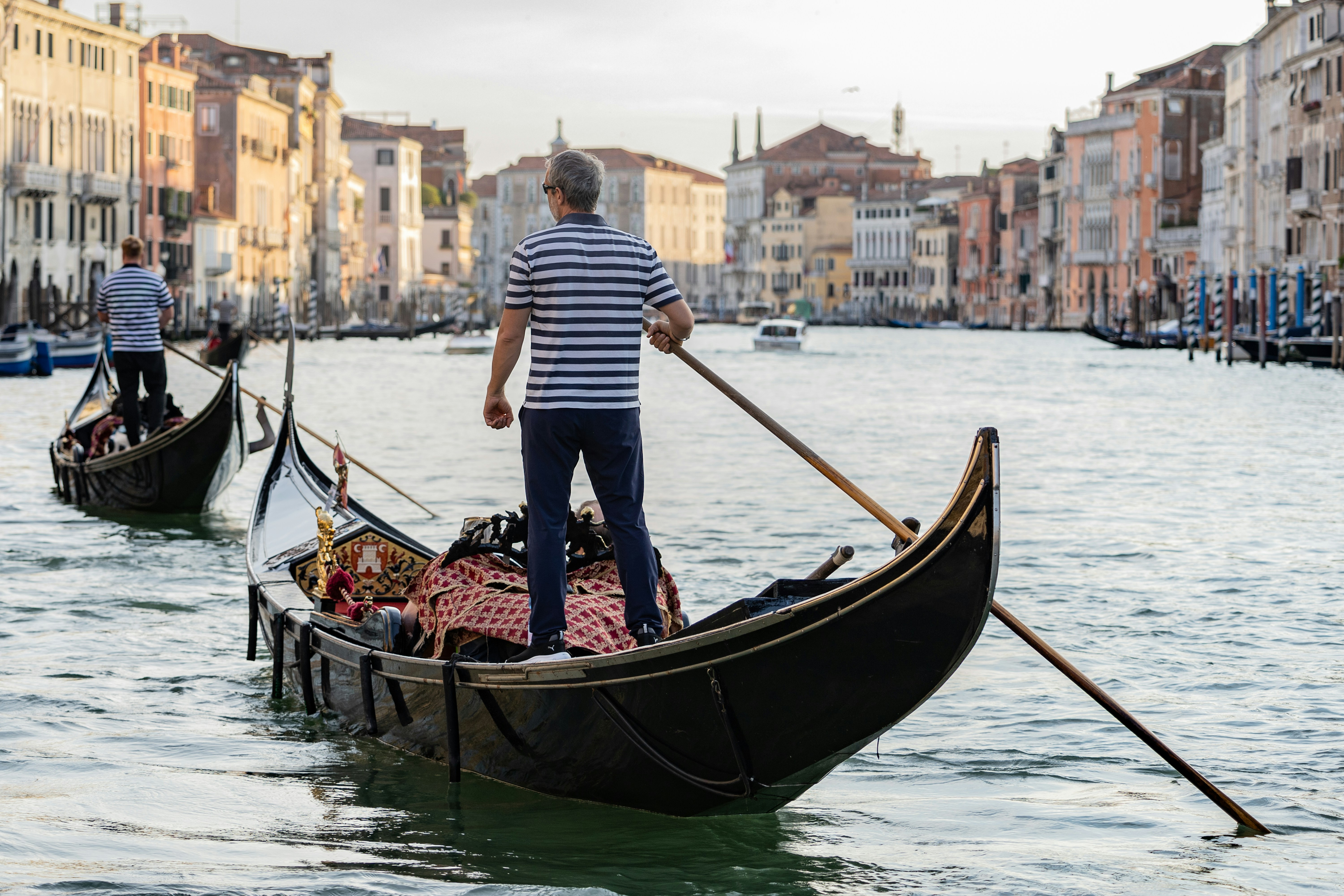 a man standing on a boat in the water