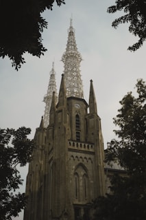 a very tall building with a clock on it's side