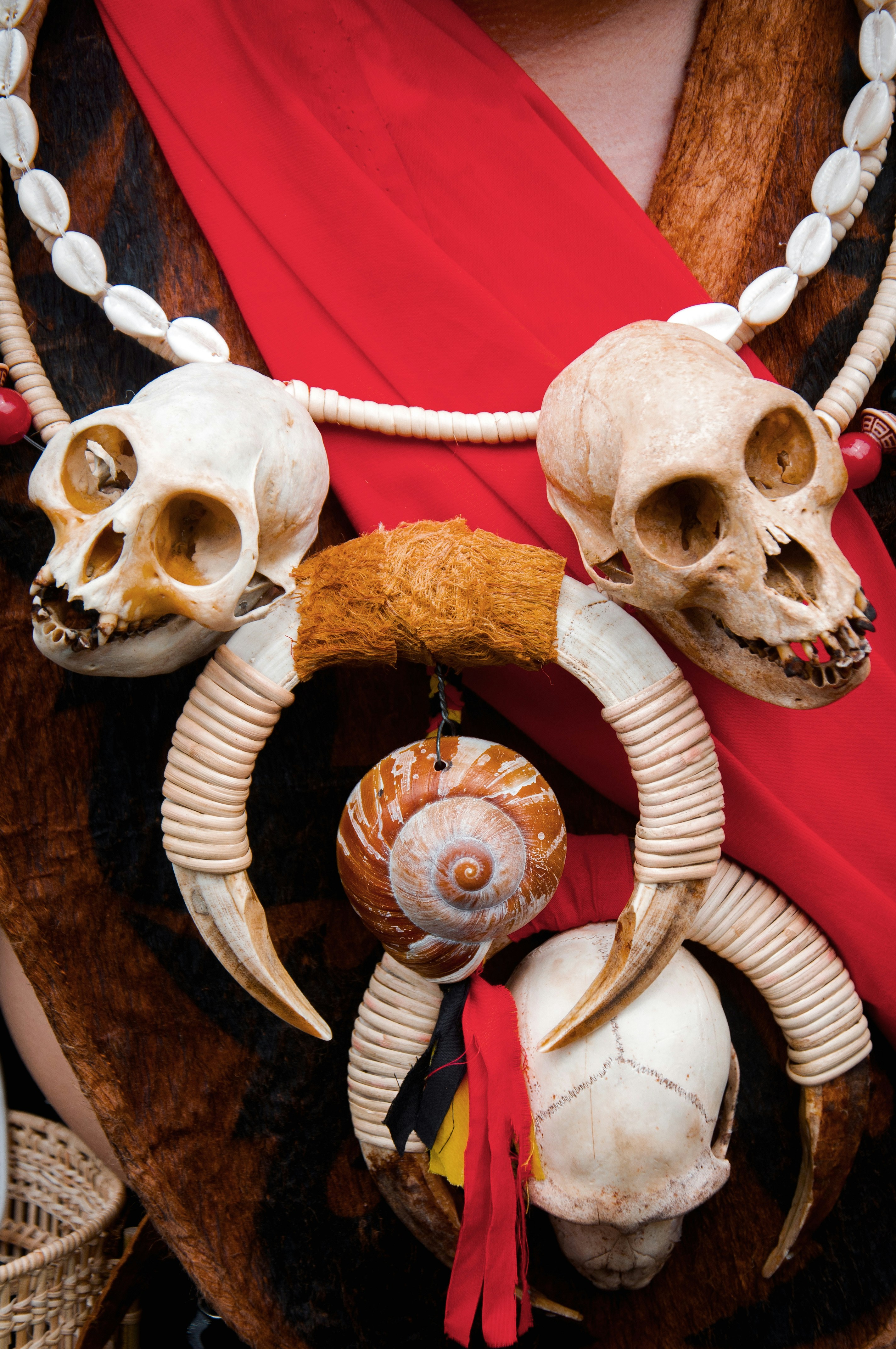 a woman wearing a red scarf with skulls on it