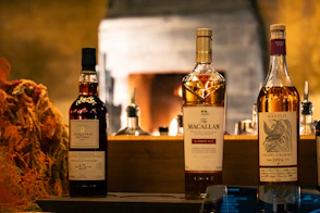three bottles of macallan are sitting on a table