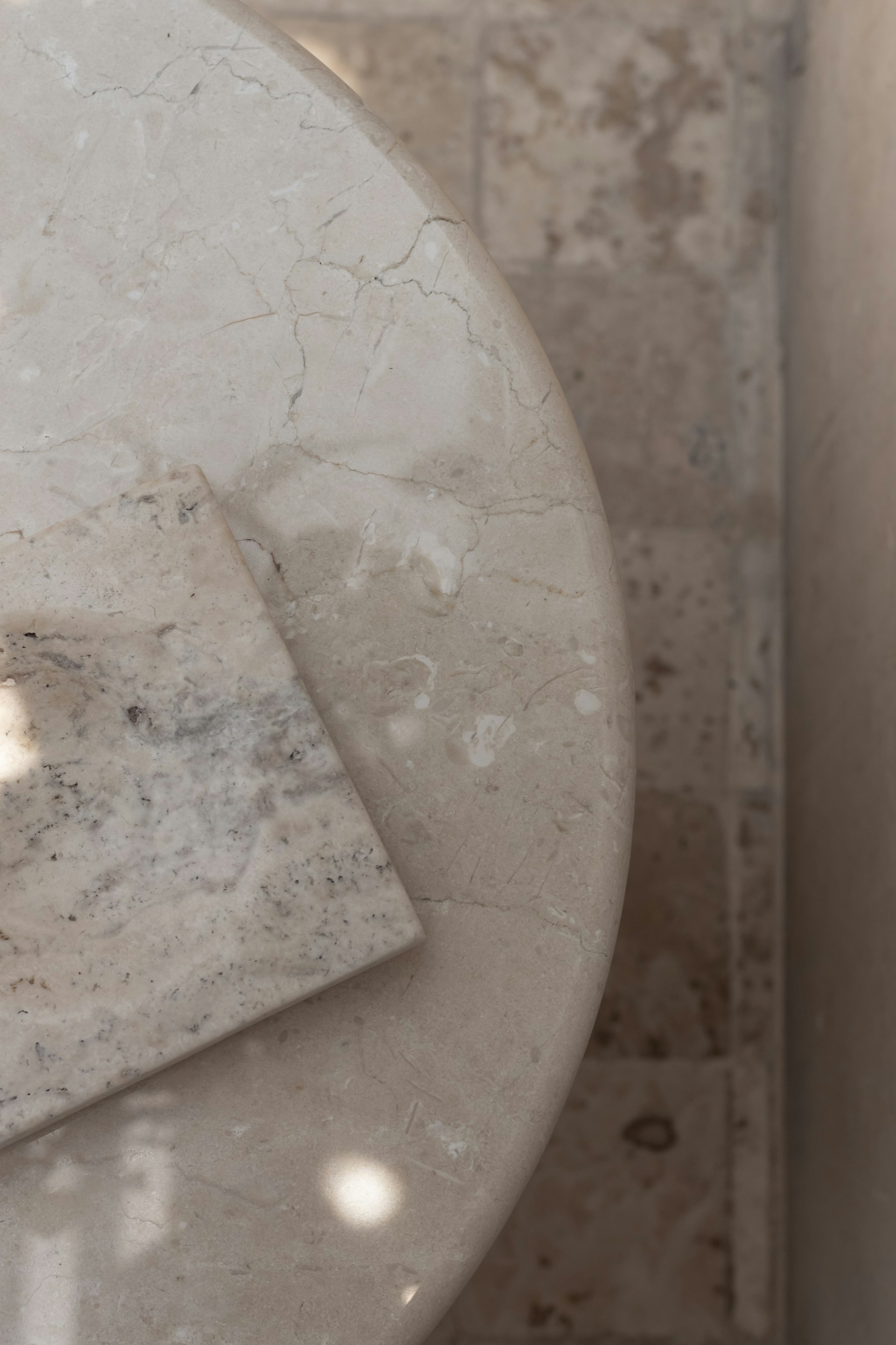 a close up of a marble table with a square object on it