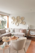 a living room filled with furniture and a large window
