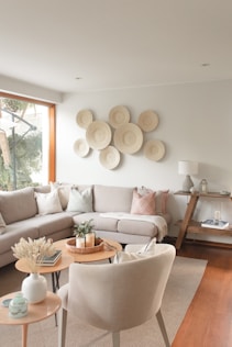 a living room filled with furniture and a large window