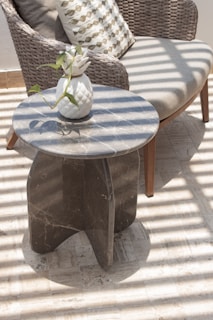 a table with a vase of flowers on top of it