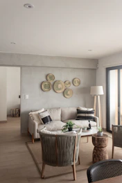 a living room filled with furniture and a large window