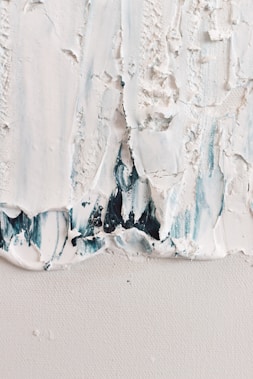 a close up of a piece of white paint