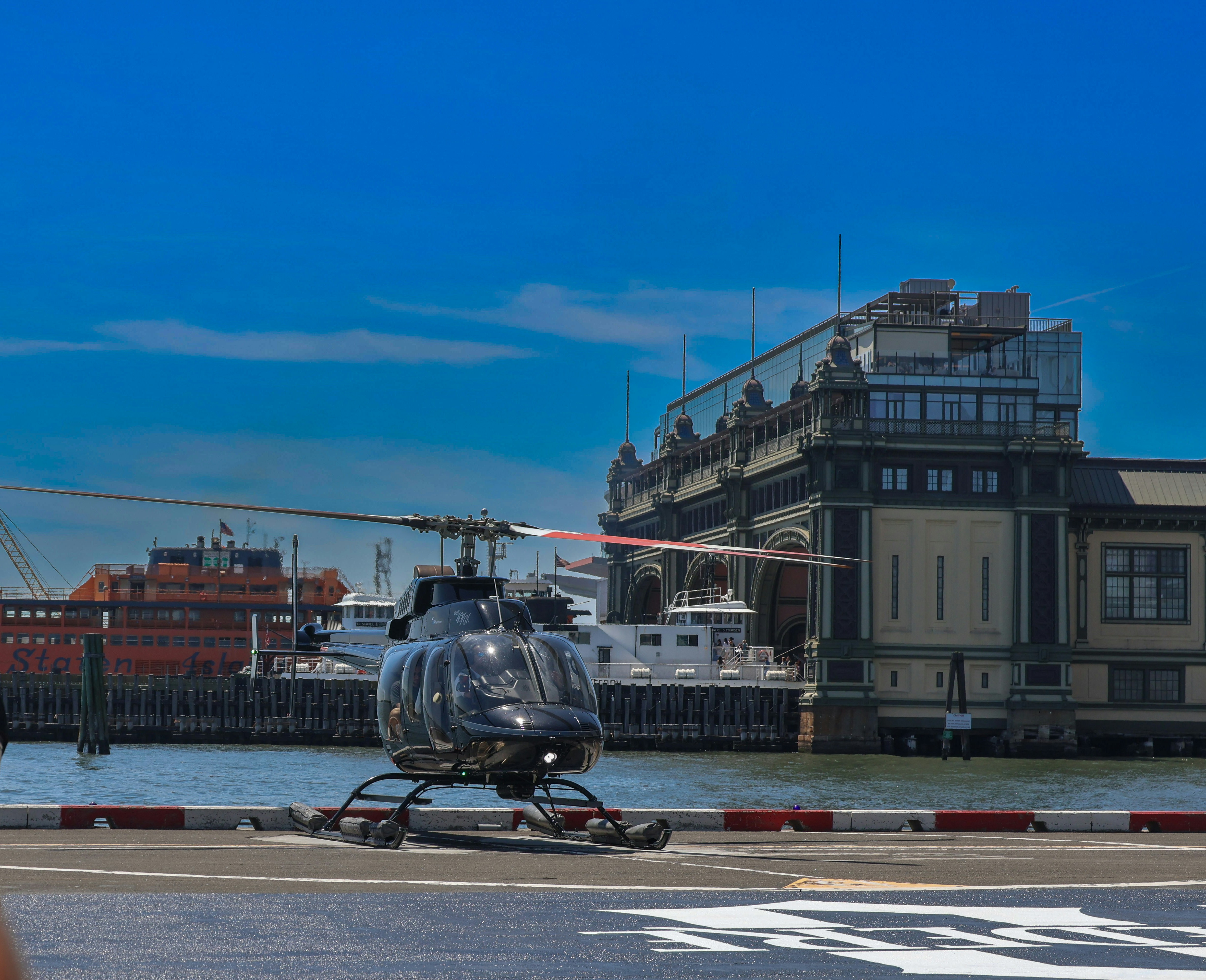 a helicopter is parked on the side of the road, Helicopter Tour