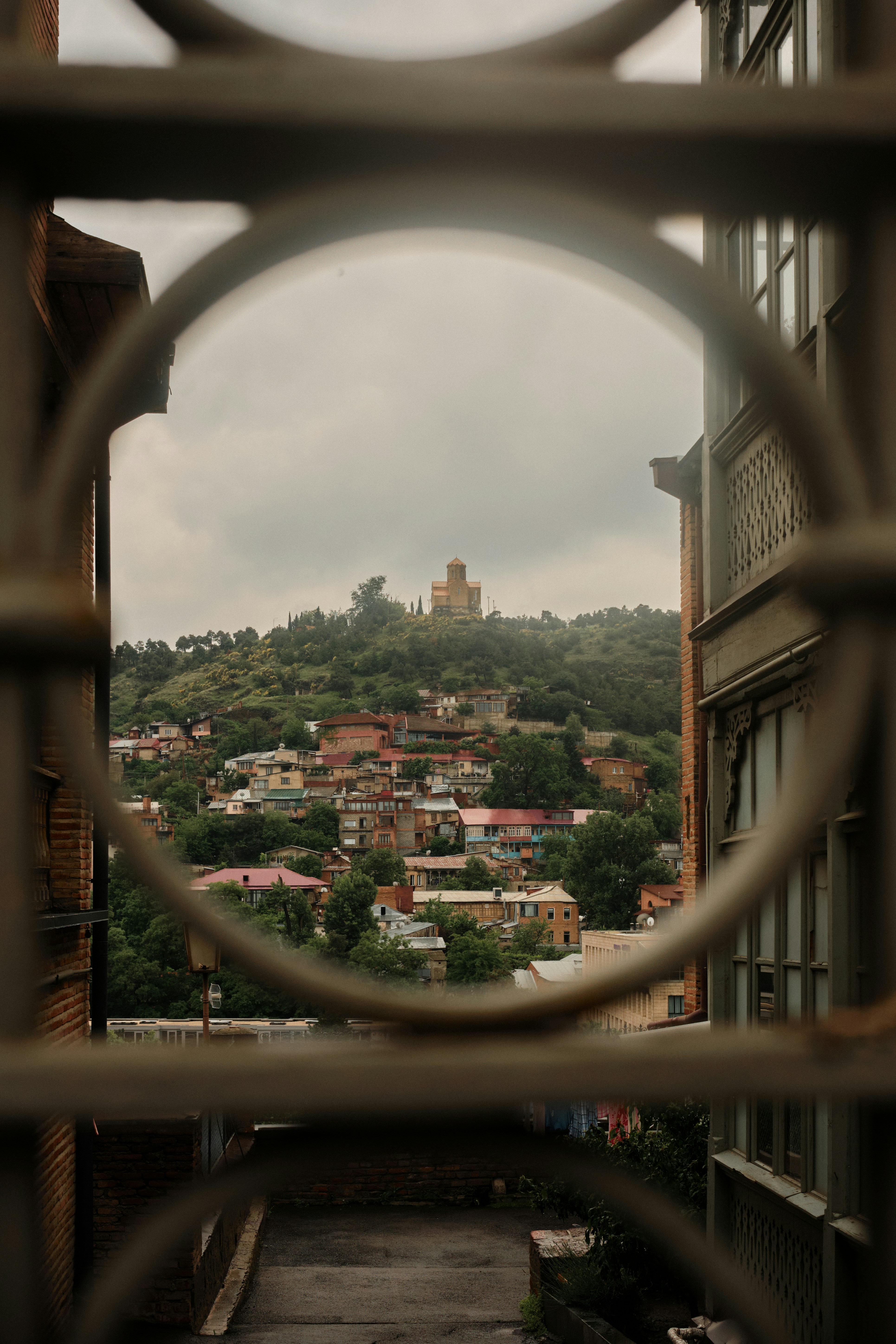 a view of a city through a gate