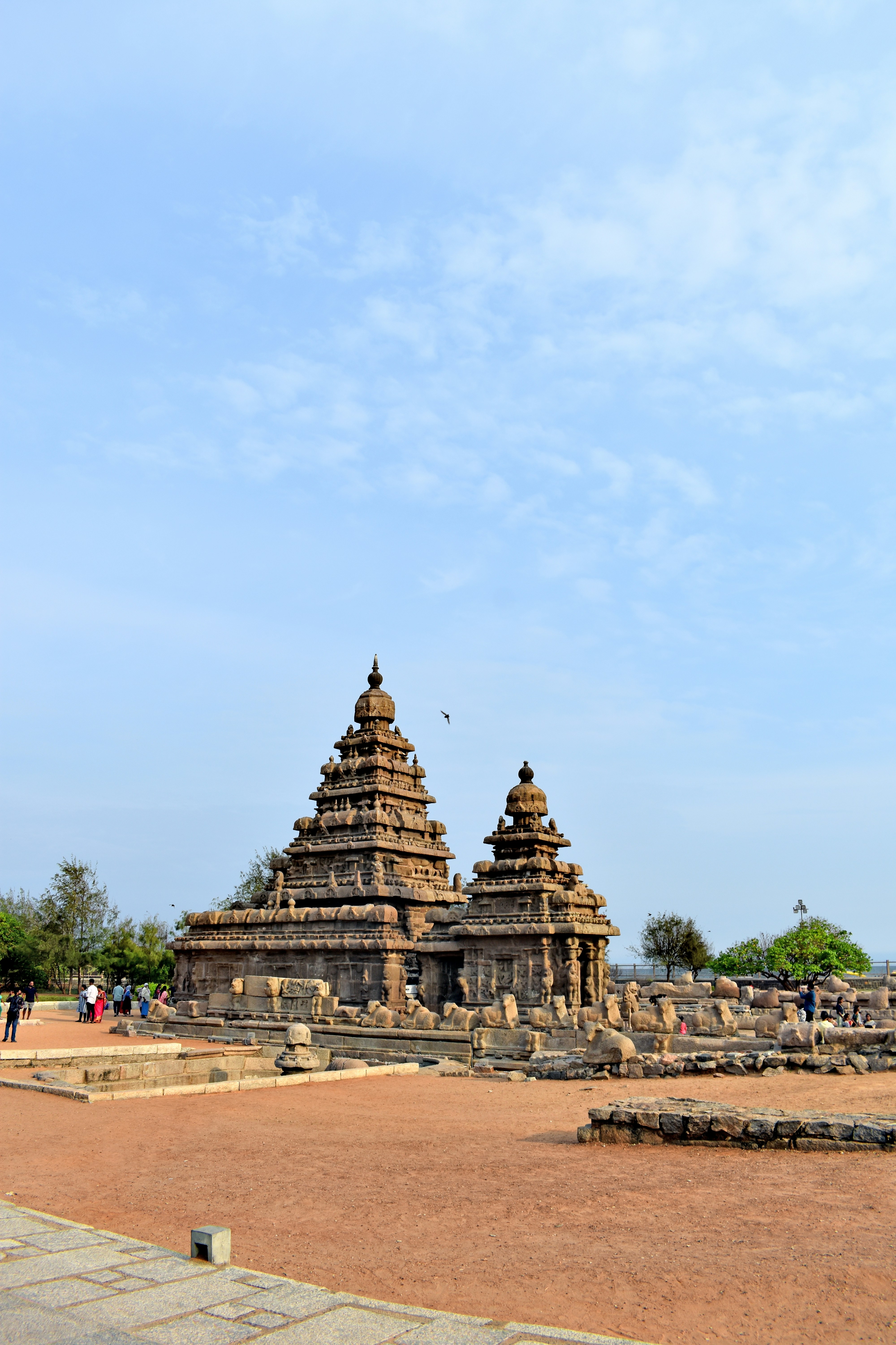 a large stone structure sitting on top of a dirt field
