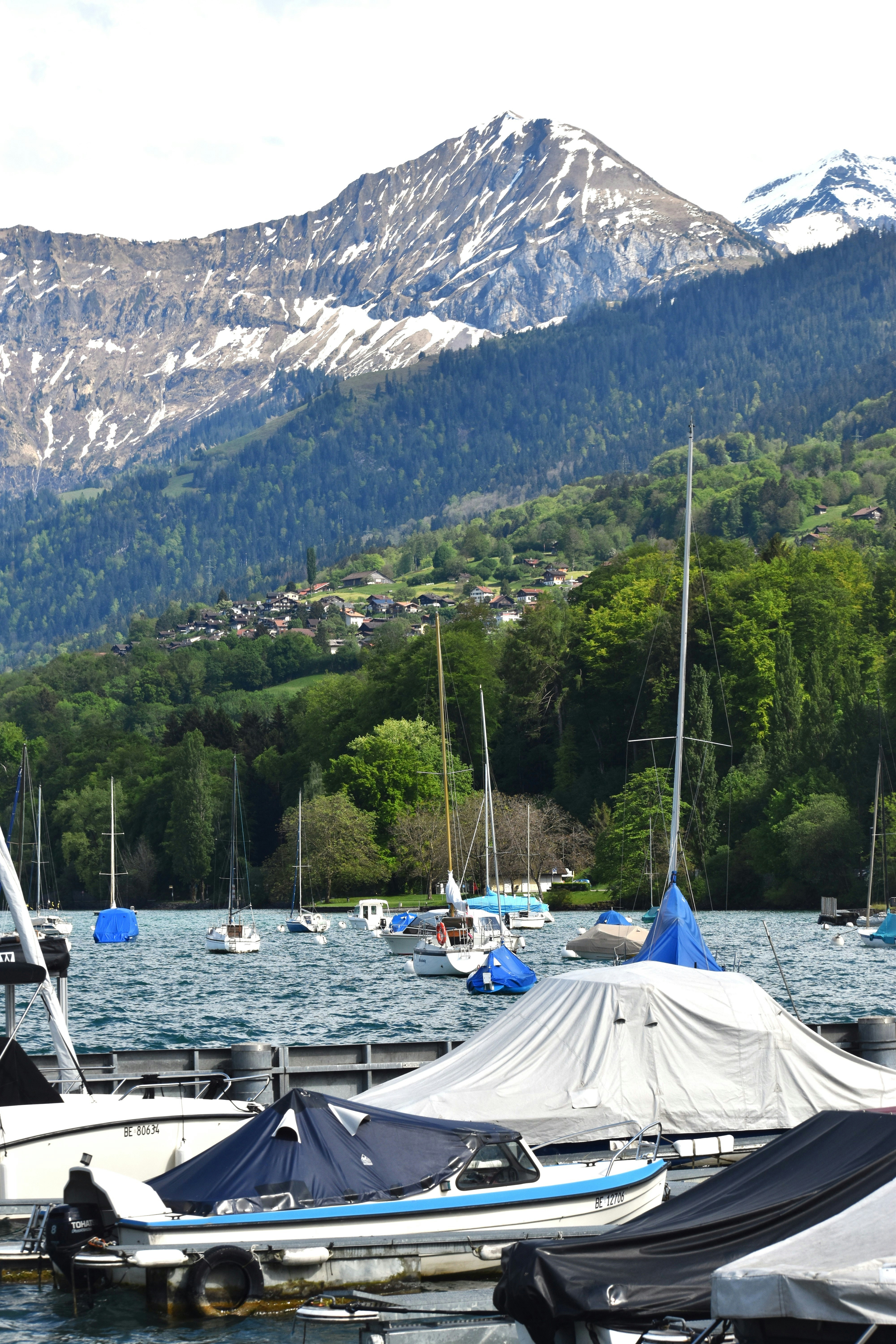a group of boats floating on top of a lake