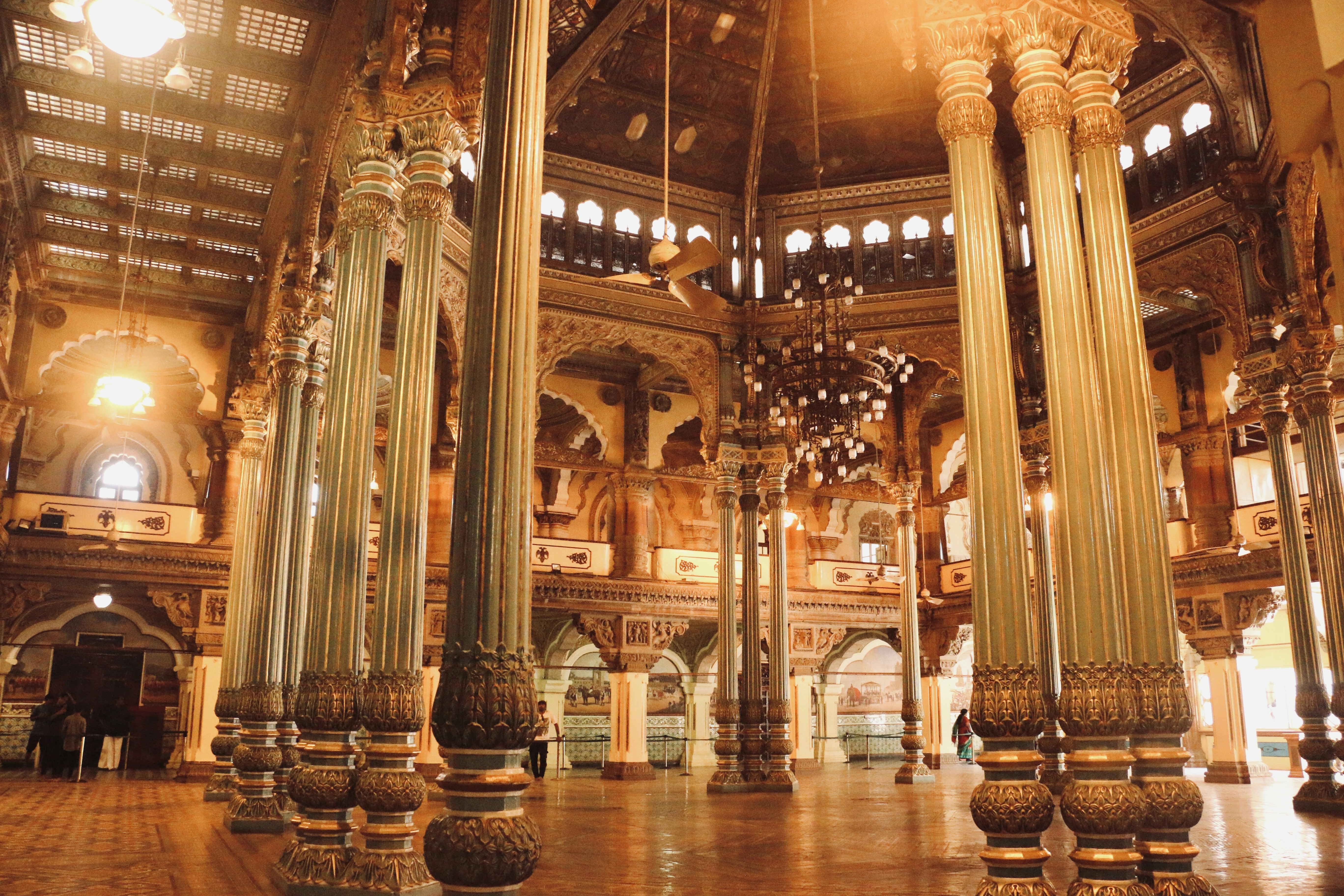 a large room with columns and lights inside of it